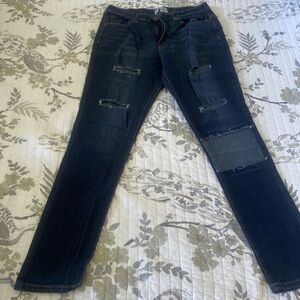Denim ripped and patched skinny jeans